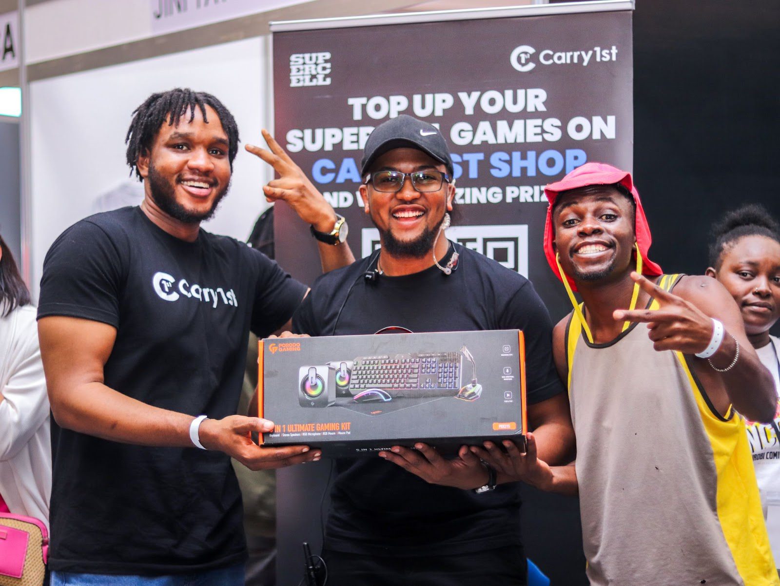 Dominion Eromosele presents a prize to a lucky gamer