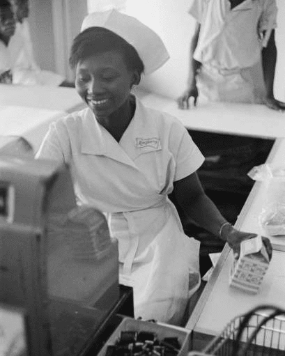 A cashier at Kingsway stores in Lagos, Nigeria. (Photo by Pix/Michael Ochs Archives/Getty Images. Circa: January,1962.